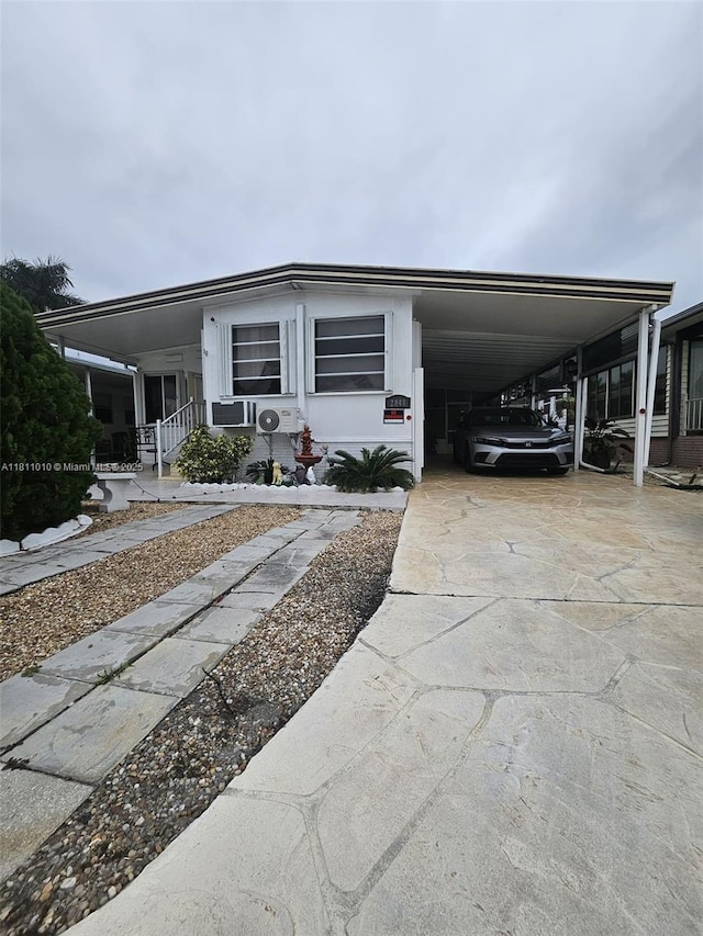 2848 W Marina Dr, Dania Beach, FL 33312 - manufactured / mobile home with a carport and driveway