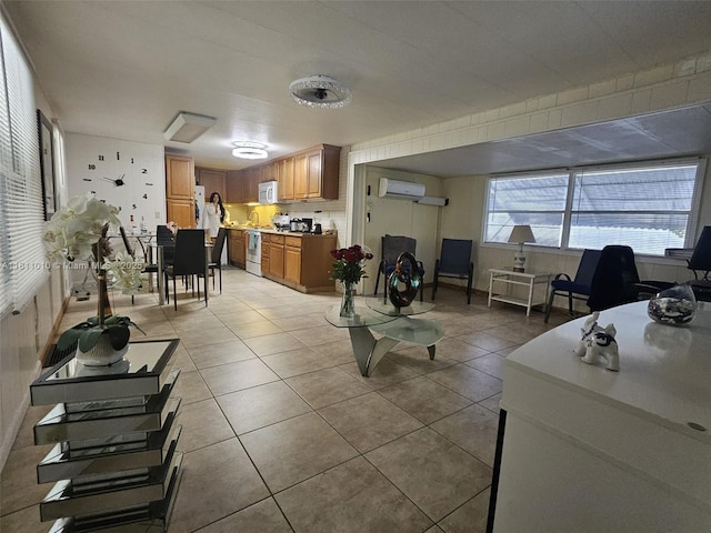 2848 W Marina Dr, Dania Beach, FL 33312 - living area with a wall mounted AC and light tile patterned floors