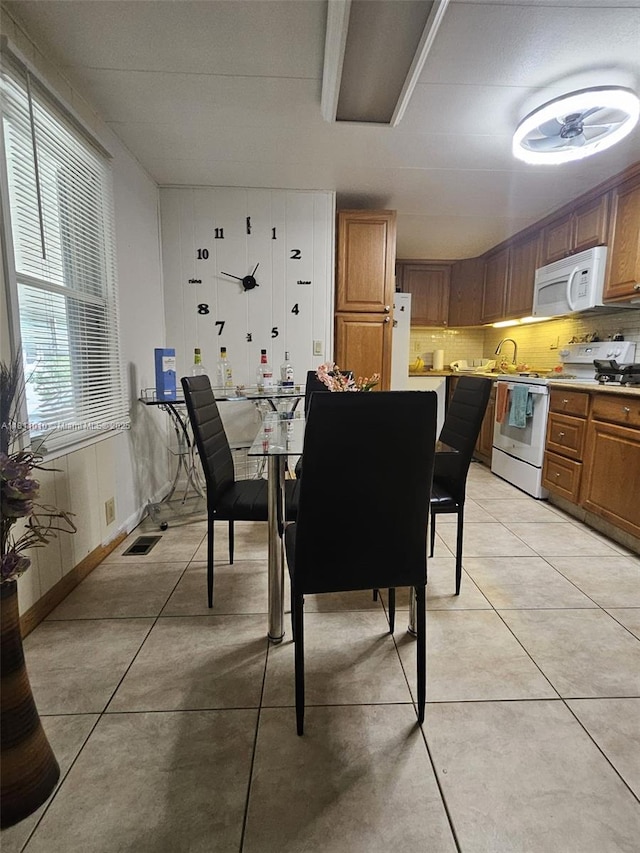 2848 W Marina Dr, Dania Beach, FL 33312 - dining space featuring light tile patterned floors