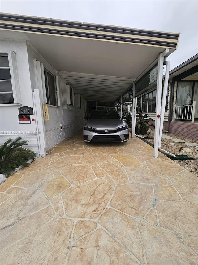 2848 W Marina Dr, Dania Beach, FL 33312 - view of car parking featuring a carport and driveway
