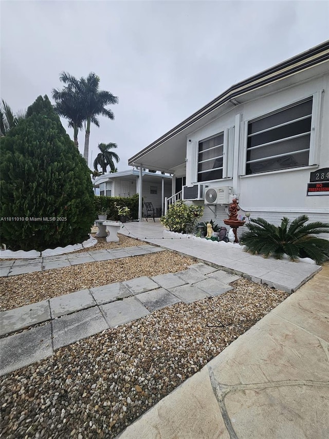 2848 W Marina Dr, Dania Beach, FL 33312 - view of side of home with a porch