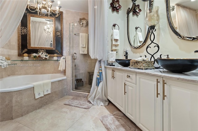 1805 Ponce De Leon Blvd Unit 1200, Coral Gables, FL 33134 - bathroom featuring a chandelier, a stall shower, a garden tub, double vanity, and tile patterned floors