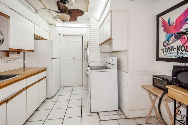 4697 SW 35th Ave, Dania Beach, FL 33312 - kitchen with white appliances, white cabinets, ceiling fan, light countertops, and light tile patterned floors