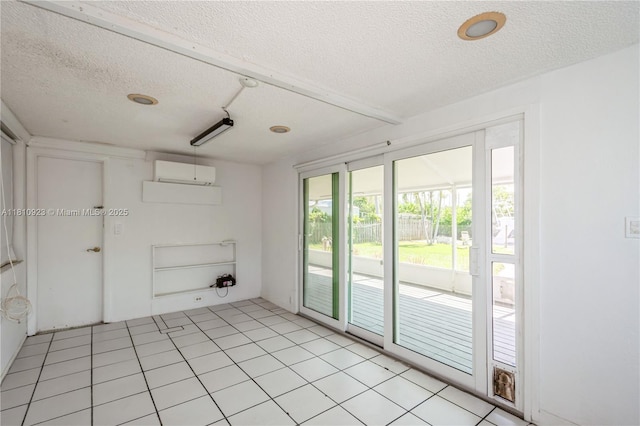 4697 SW 35th Ave, Dania Beach, FL 33312 - spare room featuring a textured ceiling and a wall mounted AC