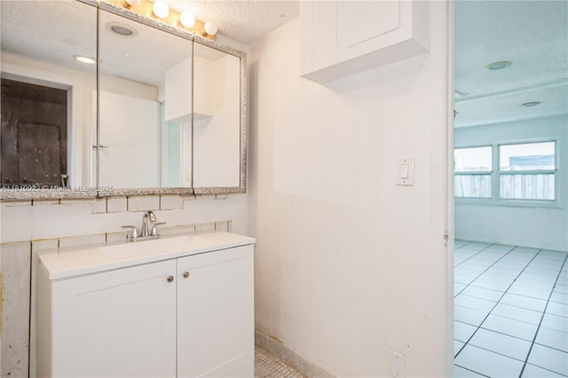 4697 SW 35th Ave, Dania Beach, FL 33312 - bathroom featuring a textured ceiling, vanity, and tile patterned floors