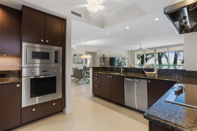 1 N Ocean Blvd Unit 508, Pompano Beach, FL 33062 - kitchen with appliances with stainless steel finishes, ceiling fan, a sink, dark brown cabinetry, and recessed lighting