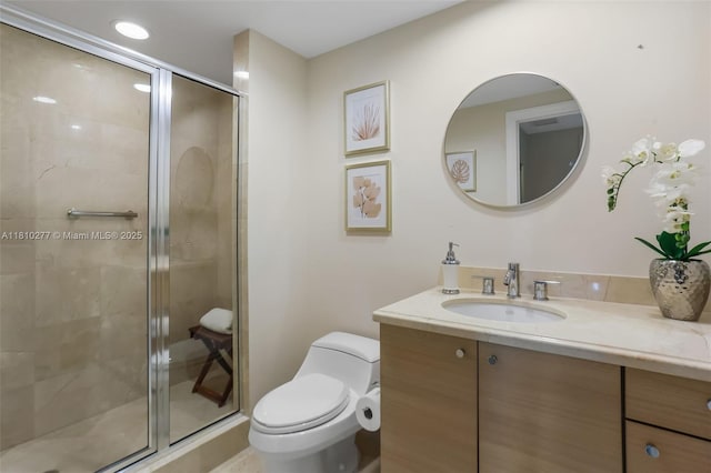 1 N Ocean Blvd Unit 508, Pompano Beach, FL 33062 - bathroom with vanity, toilet, and a shower stall