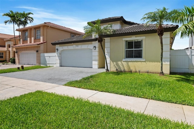 13236 SW 51st St, Miramar, FL 33027 - mediterranean / spanish home featuring stucco siding, driveway, an attached garage, and a tiled roof