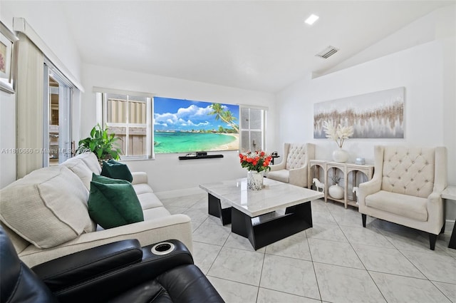 13236 SW 51st St, Miramar, FL 33027 - living area with vaulted ceiling, baseboards, and light tile patterned floors