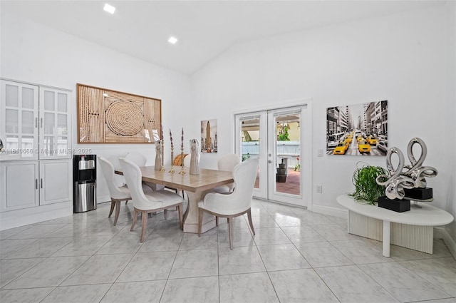 13236 SW 51st St, Miramar, FL 33027 - dining room featuring french doors, light marble finish floors, high vaulted ceiling, and baseboards