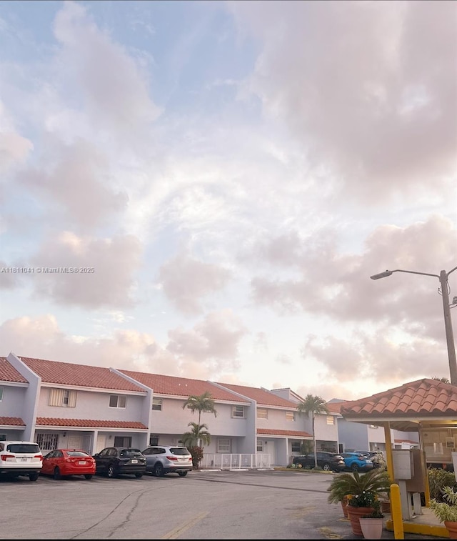 550 SW 115th Ave Unit 807D, Sweetwater, FL 33174 - view of building exterior with uncovered parking and a residential view