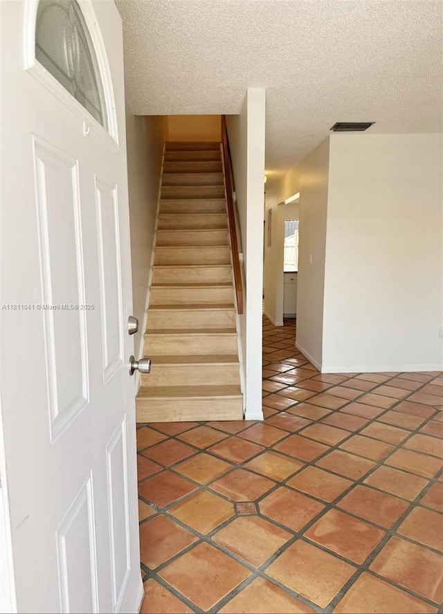 550 SW 115th Ave Unit 807D, Sweetwater, FL 33174 - stairway featuring tile patterned floors and a textured ceiling
