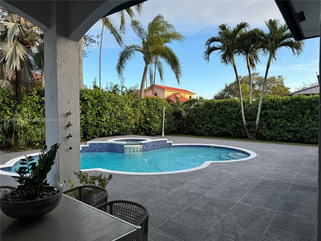 14601 SW 99th Ave, Miami, FL 33176 - view of swimming pool with a patio area and a pool with connected hot tub