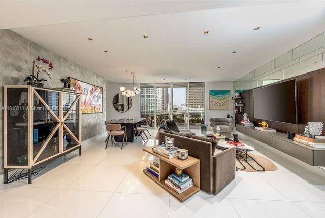 901 Brickell Key Blvd Unit 906, Miami, FL 33131 - tiled living room with a chandelier