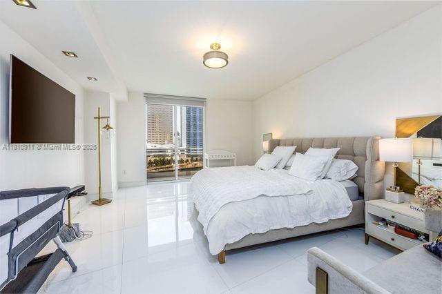 901 Brickell Key Blvd Unit 906, Miami, FL 33131 - bedroom with light tile patterned flooring and floor to ceiling windows