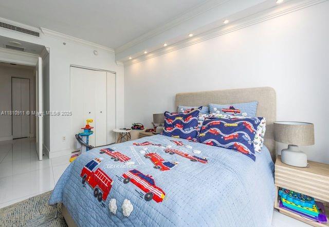 901 Brickell Key Blvd Unit 906, Miami, FL 33131 - tiled bedroom with crown molding