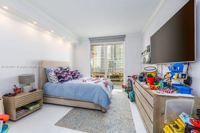 901 Brickell Key Blvd Unit 906, Miami, FL 33131 - bedroom with crown molding, recessed lighting, and tile patterned flooring