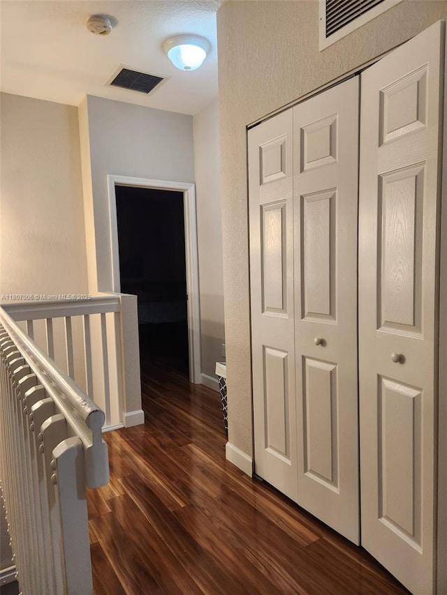 11249 NW 87th Ter, Doral, FL 33178 - hall featuring dark wood finished floors and baseboards