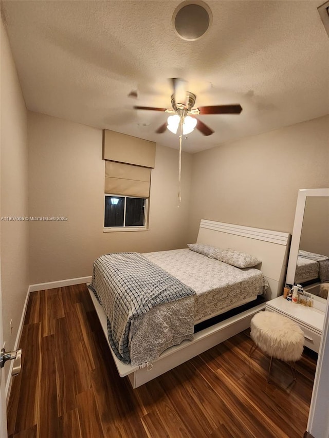 11249 NW 87th Ter, Doral, FL 33178 - bedroom featuring dark wood-style floors, a textured ceiling, a ceiling fan, and baseboards