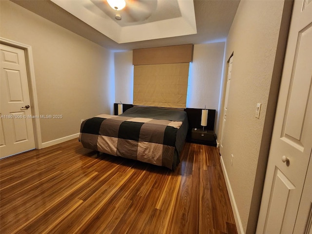 11249 NW 87th Ter, Doral, FL 33178 - bedroom featuring baseboards, wood finished floors, a textured wall, and a raised ceiling