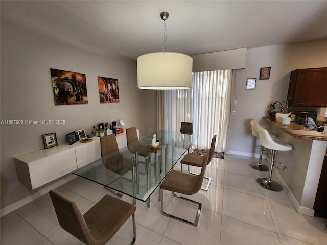 11249 NW 87th Ter, Doral, FL 33178 - dining space with baseboards and light tile patterned floors