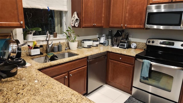 11249 NW 87th Ter, Doral, FL 33178 - kitchen featuring stainless steel appliances, a sink, and light stone counters