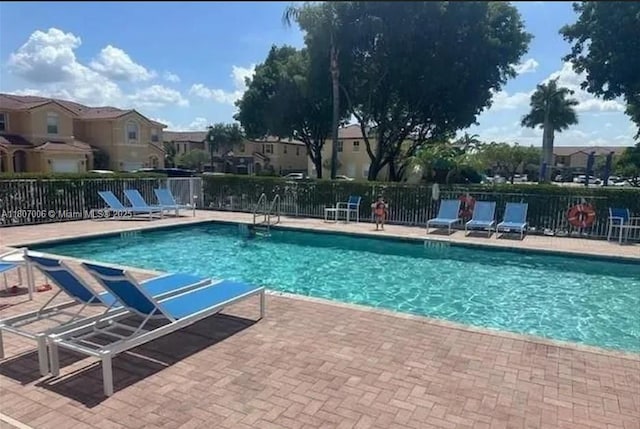 11249 NW 87th Ter, Doral, FL 33178 - community pool with a residential view and a patio