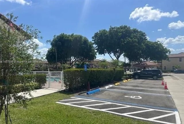 11249 NW 87th Ter, Doral, FL 33178 - uncovered parking lot featuring a gate