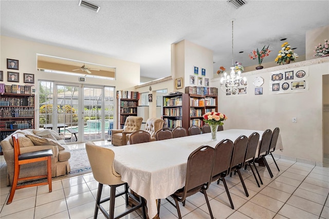 1357 Camellia Ln, Weston, FL 33326 - dining area featuring light tile patterned floors, ceiling fan, a textured ceiling, and a chandelier