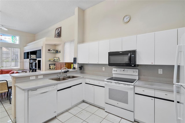 1357 Camellia Ln, Weston, FL 33326 - kitchen featuring white appliances, open shelves, a peninsula, light countertops, and light tile patterned flooring