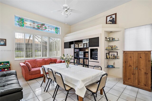 1357 Camellia Ln, Weston, FL 33326 - dining space with light tile patterned floors, a ceiling fan, and a towering ceiling