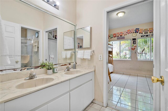 1357 Camellia Ln, Weston, FL 33326 - bathroom with tile patterned flooring, double vanity, and a stall shower