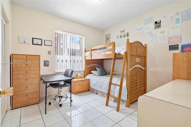 1357 Camellia Ln, Weston, FL 33326 - bedroom with an office area, light tile patterned flooring, a textured ceiling, and a closet