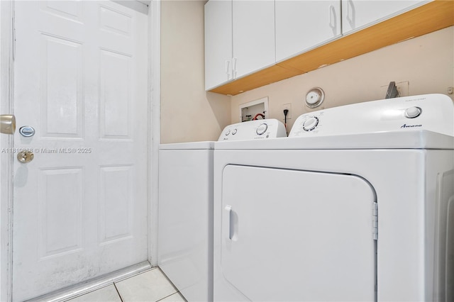 1357 Camellia Ln, Weston, FL 33326 - washroom featuring cabinet space, independent washer and dryer, and light tile patterned flooring