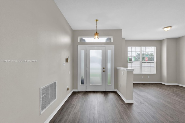 7974 Niagara Falls Ct, Orlando, FL 32825 - entryway featuring dark wood-style floors and baseboards