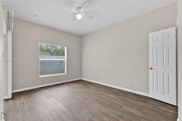 7974 Niagara Falls Ct, Orlando, FL 32825 - empty room with wood finished floors, a ceiling fan, and baseboards