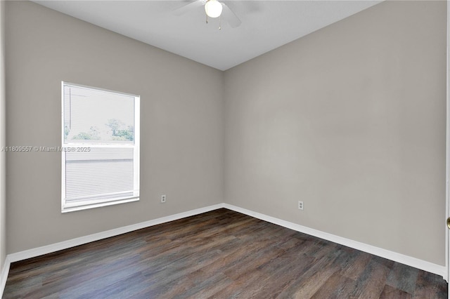 7974 Niagara Falls Ct, Orlando, FL 32825 - empty room with a ceiling fan, dark wood finished floors, and baseboards