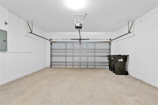 7974 Niagara Falls Ct, Orlando, FL 32825 - garage featuring concrete block wall, electric panel, and a garage door opener