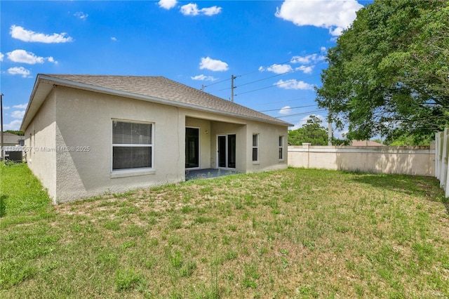 7974 Niagara Falls Ct, Orlando, FL 32825 - back of house featuring stucco siding, central air condition unit, and a shingled roof