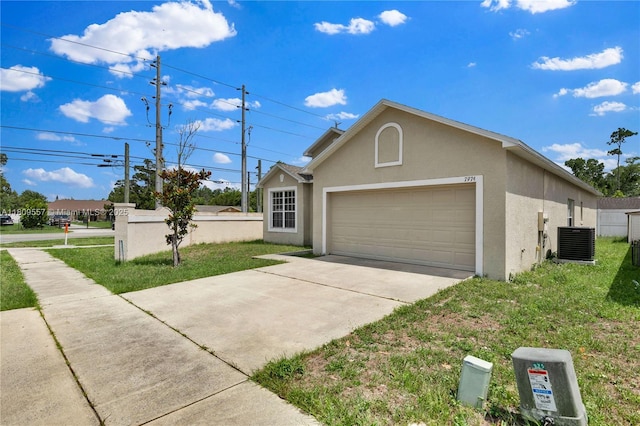 7974 Niagara Falls Ct, Orlando, FL 32825 - view of property exterior with stucco siding, central air condition unit, a garage, driveway, and a lawn