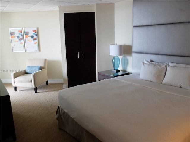 2670 E Sunrise Blvd Unit 523, Fort Lauderdale, FL 33304 - carpeted bedroom with baseboards and a paneled ceiling