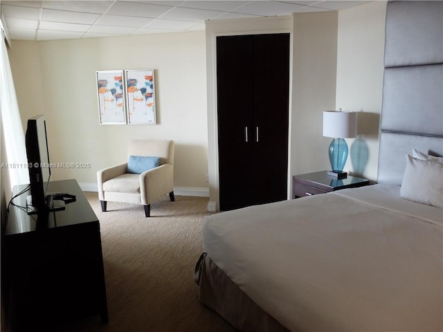 2670 E Sunrise Blvd Unit 523, Fort Lauderdale, FL 33304 - carpeted bedroom with baseboards and a paneled ceiling