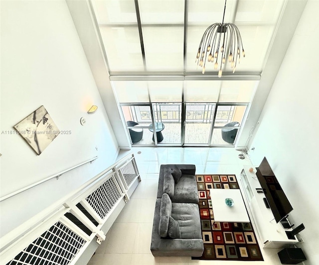 253 NE 2nd St Unit 625, Miami, FL 33132 - living room with a chandelier, plenty of natural light, and tile patterned floors