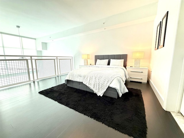 253 NE 2nd St Unit 625, Miami, FL 33132 - bedroom with dark wood-style flooring and baseboards