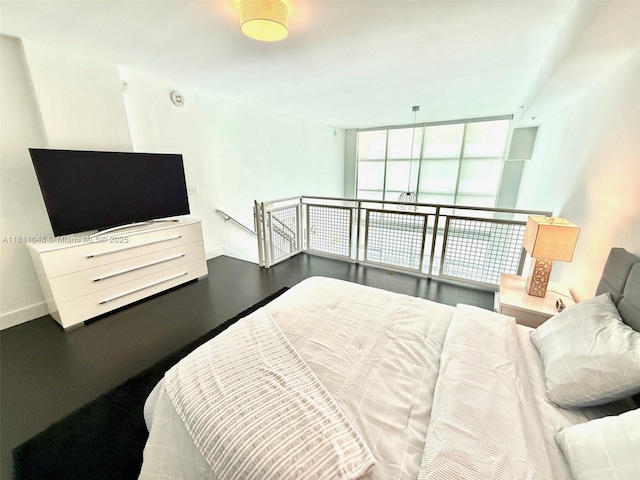 253 NE 2nd St Unit 625, Miami, FL 33132 - bedroom with baseboards and wood finished floors