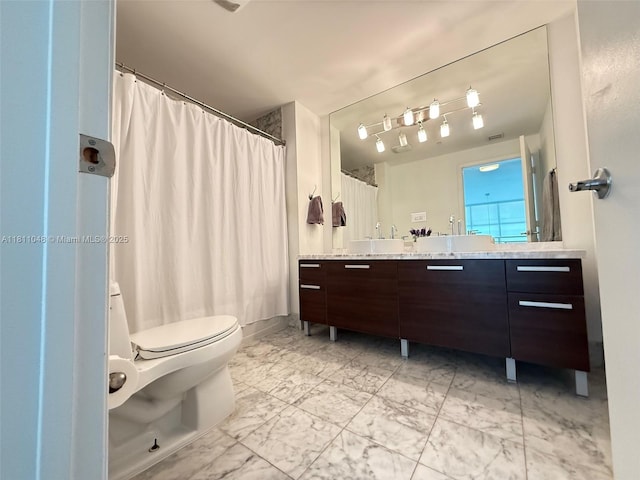 253 NE 2nd St Unit 625, Miami, FL 33132 - bathroom with marble finish flooring, double vanity, toilet, and a shower with curtain
