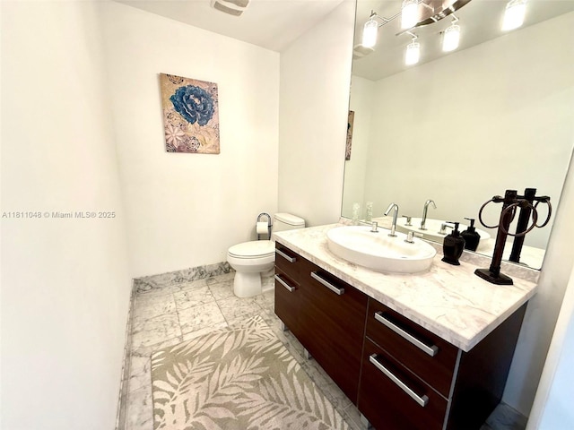 253 NE 2nd St Unit 625, Miami, FL 33132 - bathroom featuring vanity, toilet, and baseboards