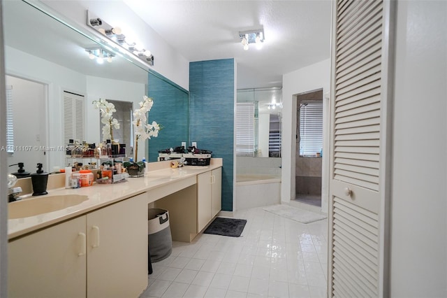 14816 SW 104th St Unit 85, Miami, FL 33196 - bathroom featuring a closet, double vanity, a bath, and tile patterned floors