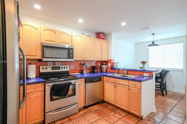 14816 SW 104th St Unit 85, Miami, FL 33196 - kitchen with appliances with stainless steel finishes, a sink, a peninsula, backsplash, and recessed lighting