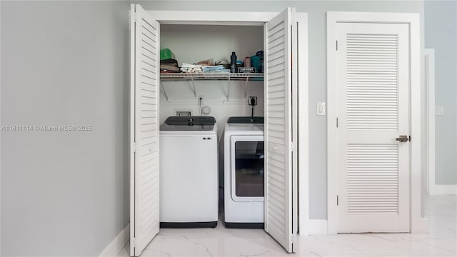 19120 SW 127th Pl, Miami, FL 33177 - laundry room featuring light marble finish floors, washing machine and clothes dryer, and baseboards